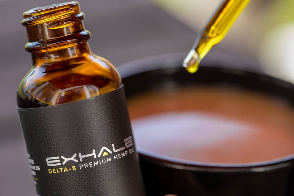 dropping-exhale-d8-hemp-oil-in-coffee.jpg