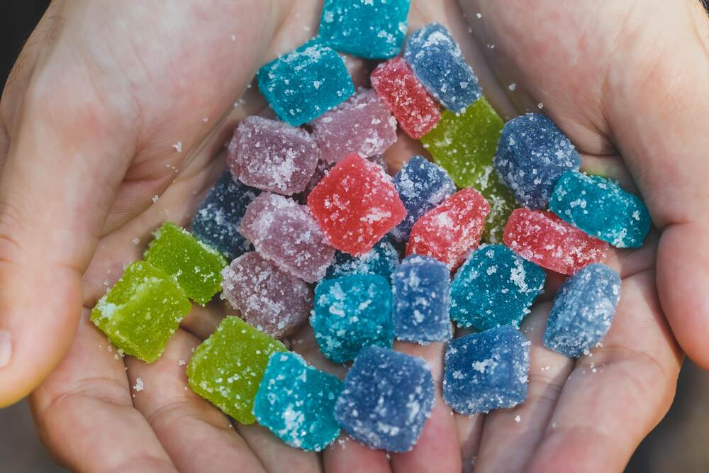 person holding thc gummies