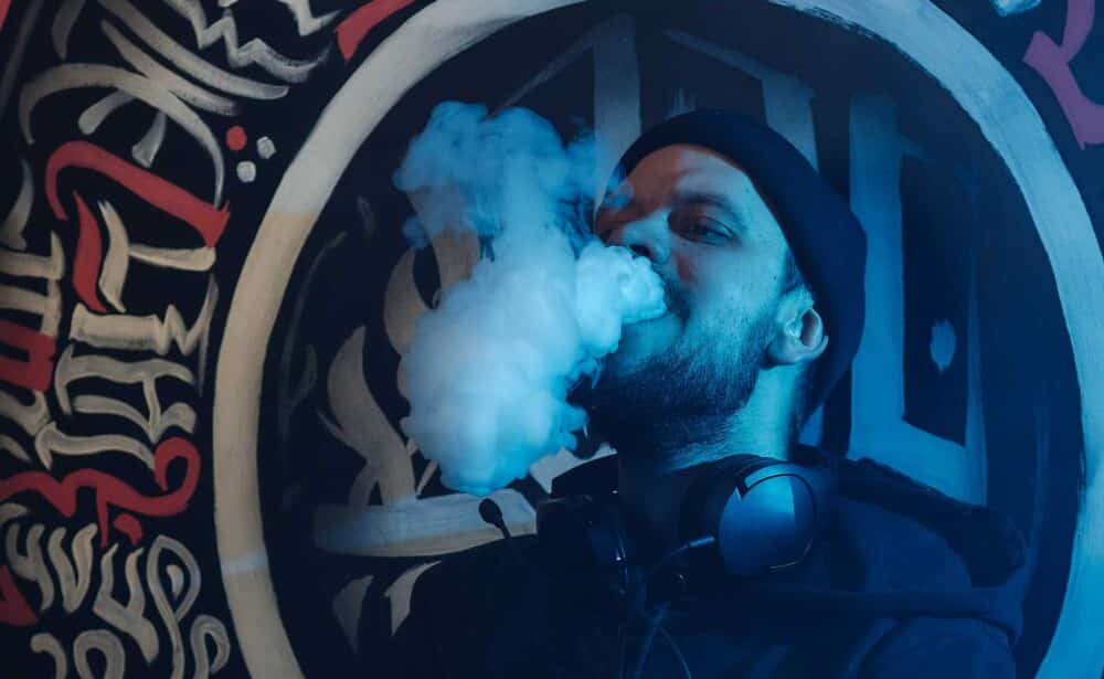 man exhaling thc vape vapor