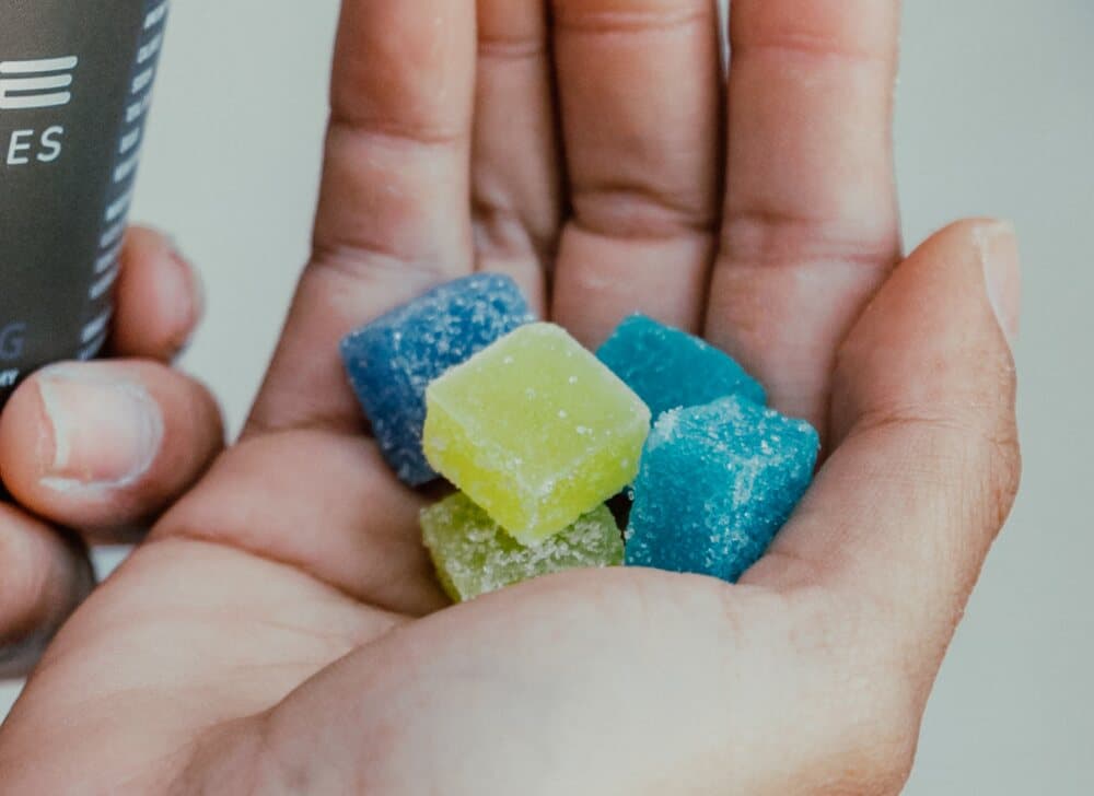 person holding cbn gummies for sleep