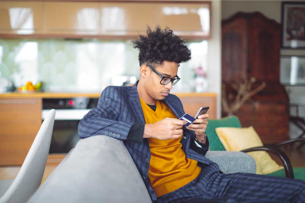 young man ordering online from exhale wellness