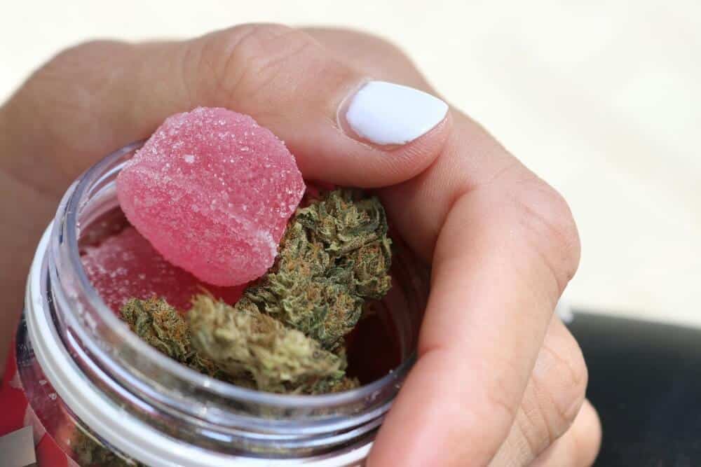 female-hand-libido-gummy-flower-jar