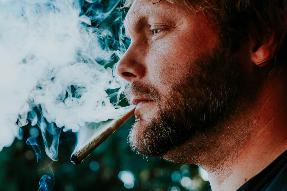 man-smoking-joint-side-profile