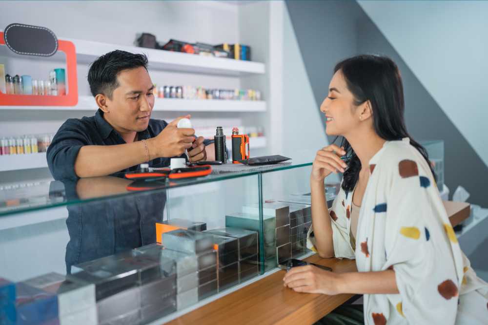 man teaching woman how to fix a burnt vape