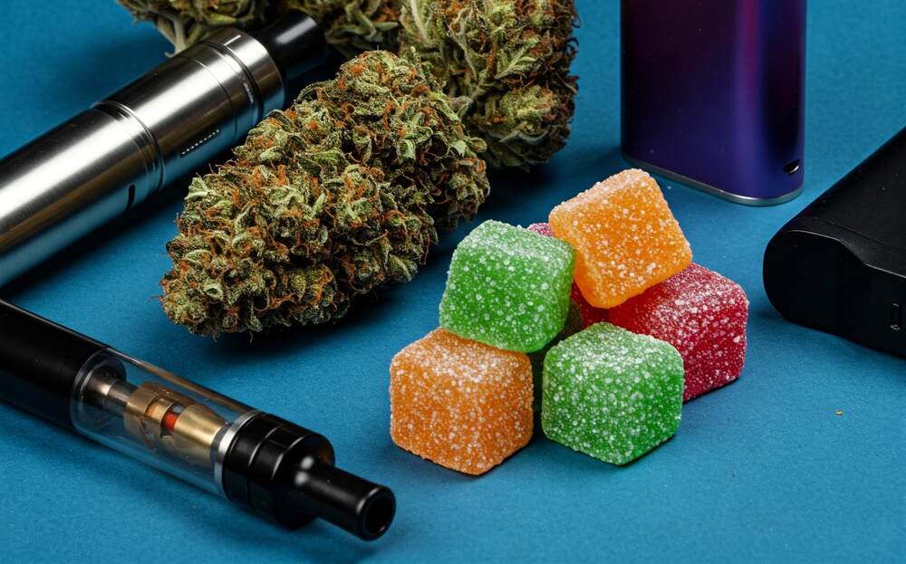 delta 9 gummies flower vapes on blue table