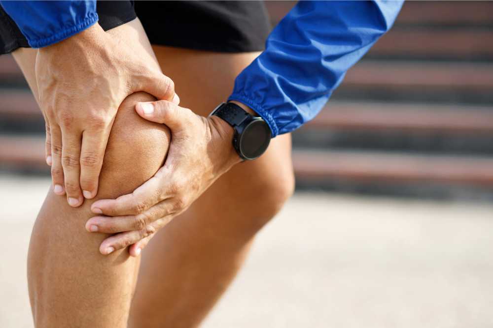 person feeling knee pain closeup