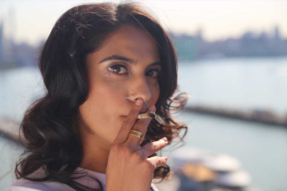 closeup of woman smoking joint