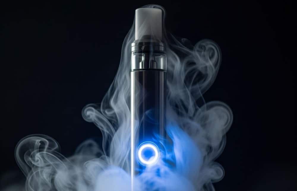 closeup shot of vape pen with blue blinking light